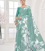turqoise light blue  printed saree with blouse or saraowski border