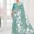 turqoise light blue  premium printed saree with blouse or saraowski border