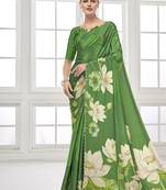green  printed saree with blouse or saraowski border