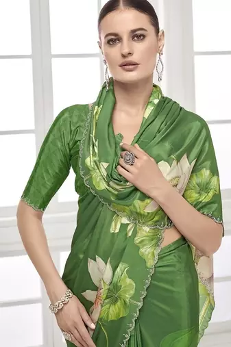 green  printed saree with blouse or saraowski border