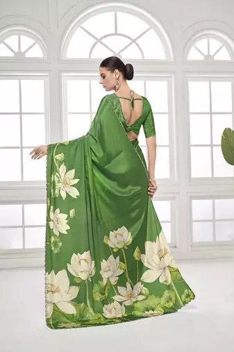 green  printed saree with blouse or saraowski border