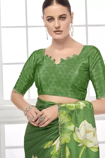 green  printed saree with blouse or saraowski border