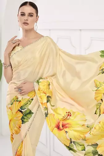 Yellow  printed saree with blouse or saraowski border