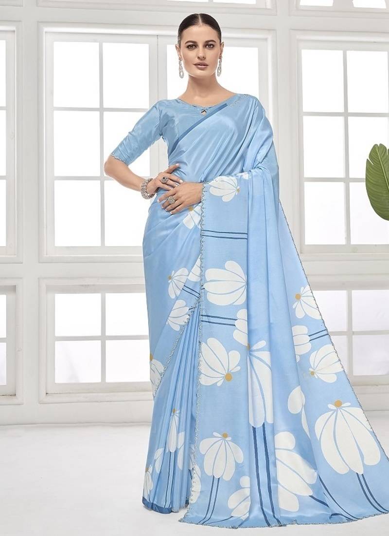 sky blue  premium printed saree with blouse or saraowski border
