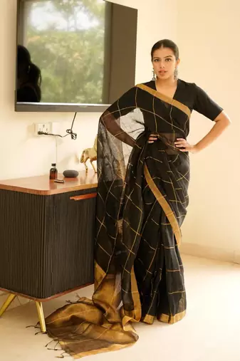 black linen saree with golden zari checks & border