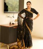 black linen saree with golden zari checks & border
