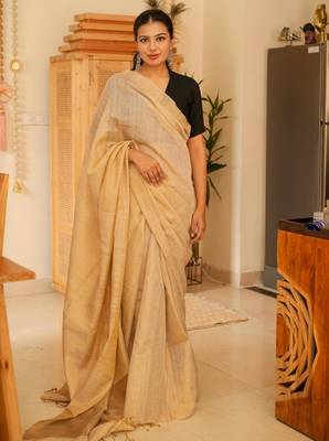 sunehri handwoven beige-gold tissue linen saree with subtle zari highlights 1