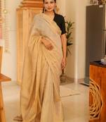 sunehri handwoven beige-gold tissue linen saree with subtle zari highlights