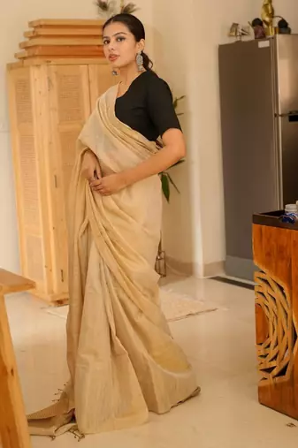 sunehri handwoven beige-gold tissue linen saree with subtle zari highlights