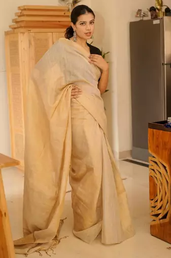 sunehri handwoven beige-gold tissue linen saree with subtle zari highlights
