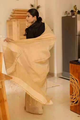 sunehri handwoven beige-gold tissue linen saree with subtle zari highlights