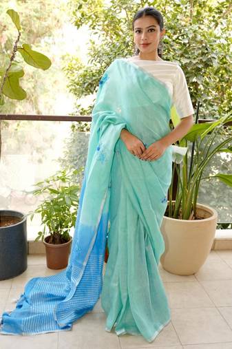 aqua blue linen saree with hand embroidered floral motifs