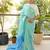 aqua blue linen saree with hand embroidered floral motifs