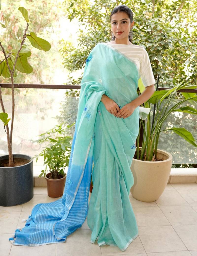 aqua blue linen saree with hand embroidered floral motifs