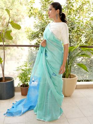 aqua blue linen saree with hand embroidered floral motifs 2
