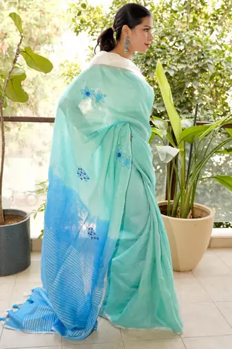 aqua blue linen saree with hand embroidered floral motifs