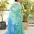 aqua blue linen saree with hand embroidered floral motifs