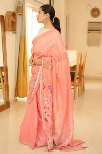elegant handwoven pink linen saree with floral embroidery