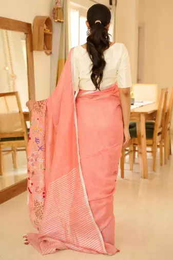 elegant handwoven pink linen saree with floral embroidery