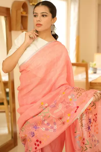 elegant handwoven pink linen saree with floral embroidery