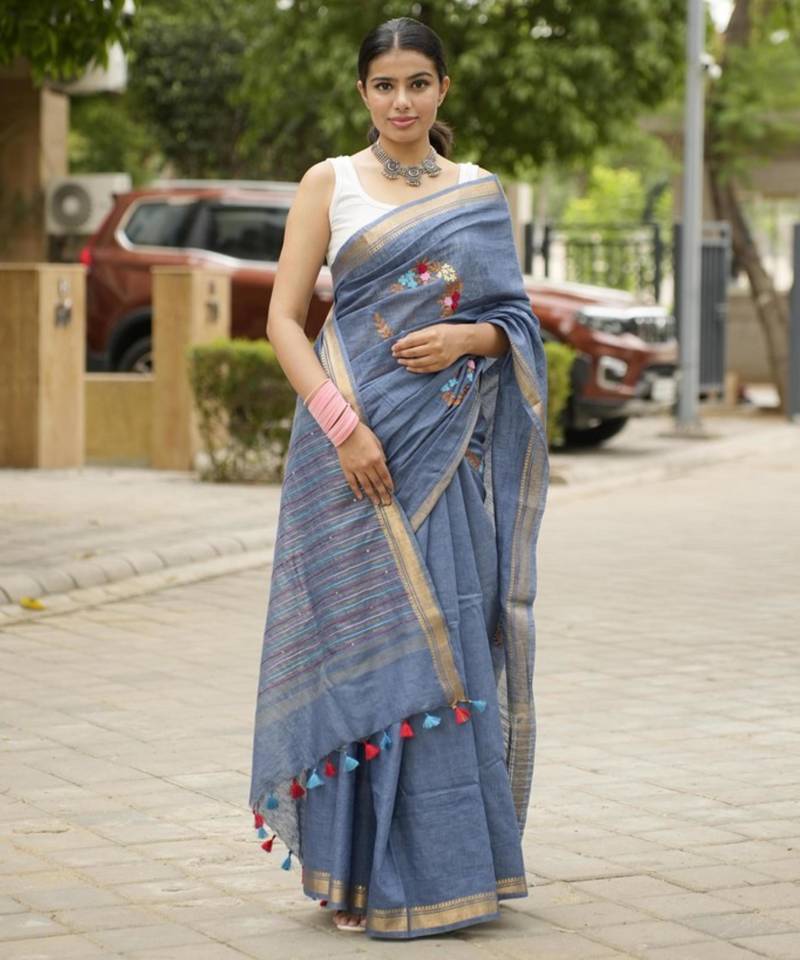handwoven blue linen saree with tassel & hand embroidery
