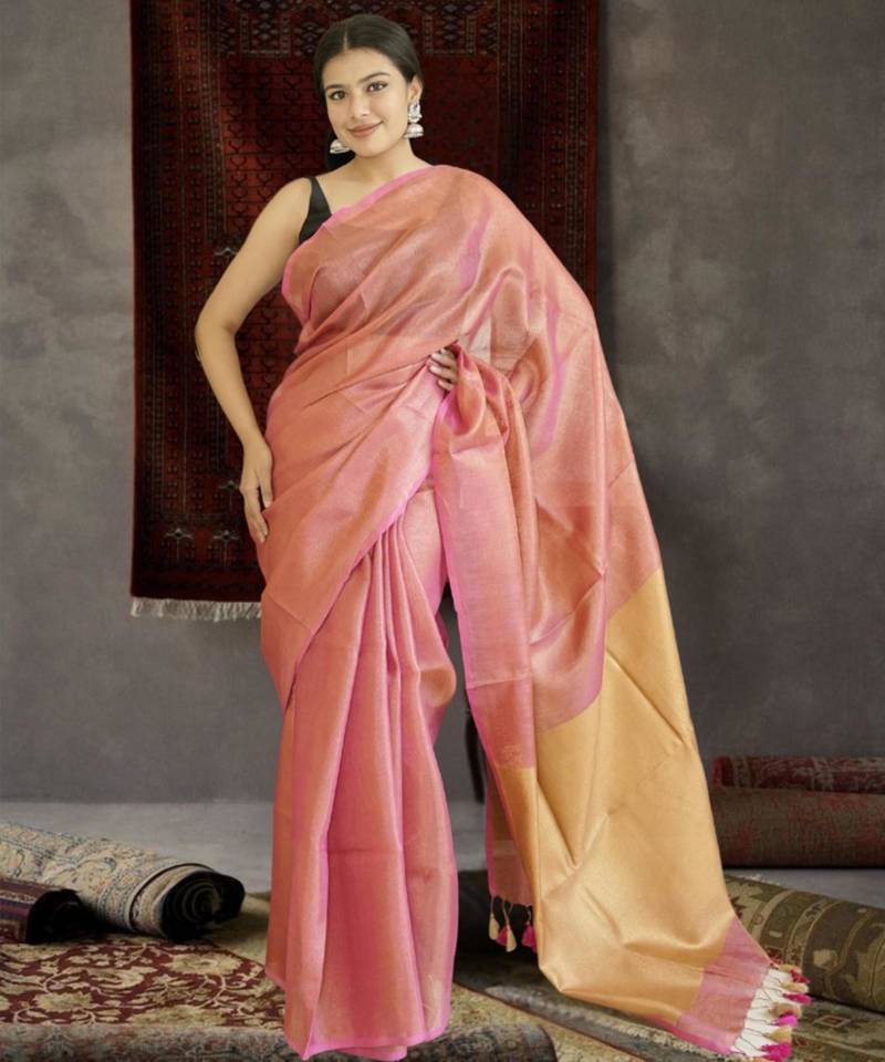 orange tissue linen saree with golden zari pallu