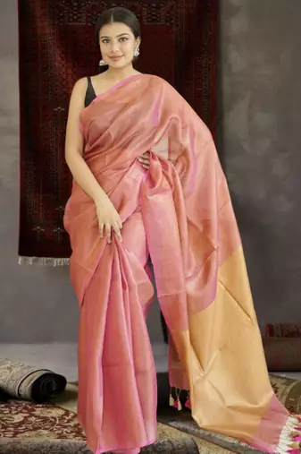 orange tissue linen saree with golden zari pallu