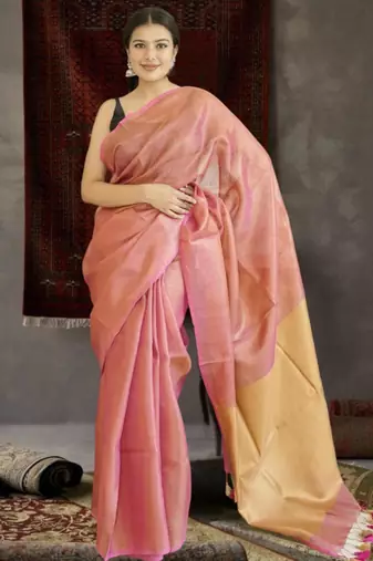 orange tissue linen saree with golden zari pallu
