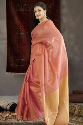 orange tissue linen saree with golden zari pallu