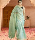 green tissue linen saree with zari border