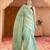 green tissue linen saree with zari border