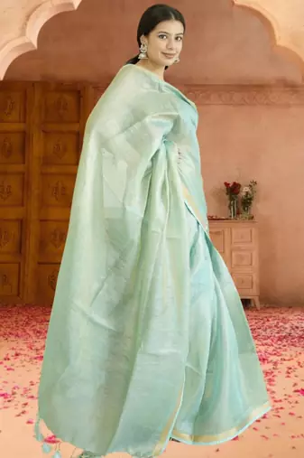 green tissue linen saree with zari border