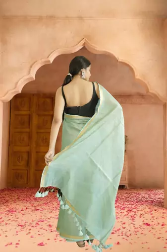 green tissue linen saree with zari border