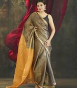 grey tissue linen saree with golden zari pallu