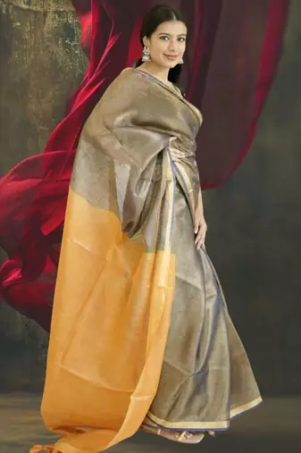 grey tissue linen saree with golden zari pallu