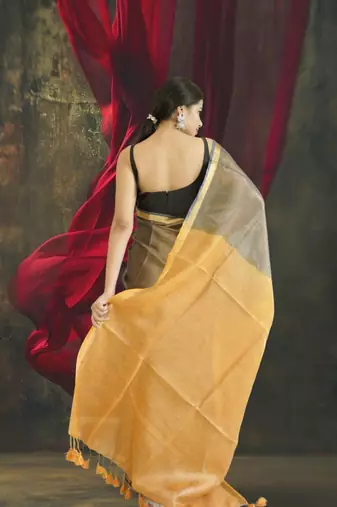 grey tissue linen saree with golden zari pallu