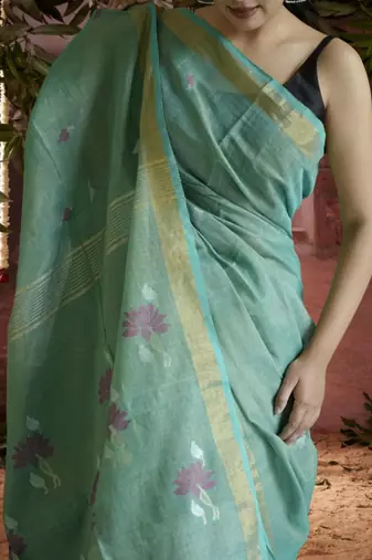 green linen silk blend saree with zari border
