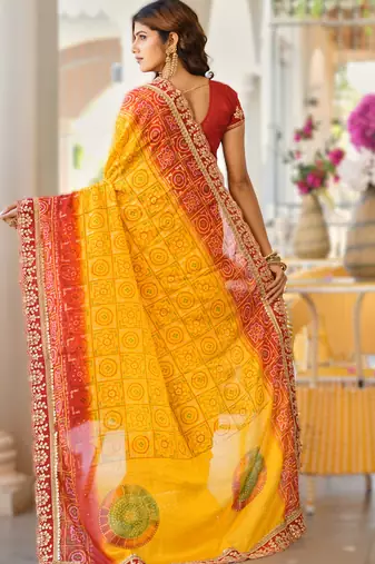  yellow fancy print bandhani saree moss chiffon with work blouse