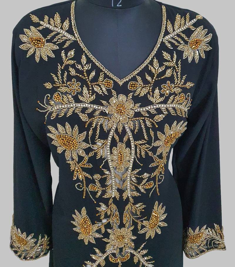Elegant black georgette kaftan gown with golden zari work With hijab.