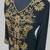 Elegant black georgette kaftan gown with golden zari work With hijab.
