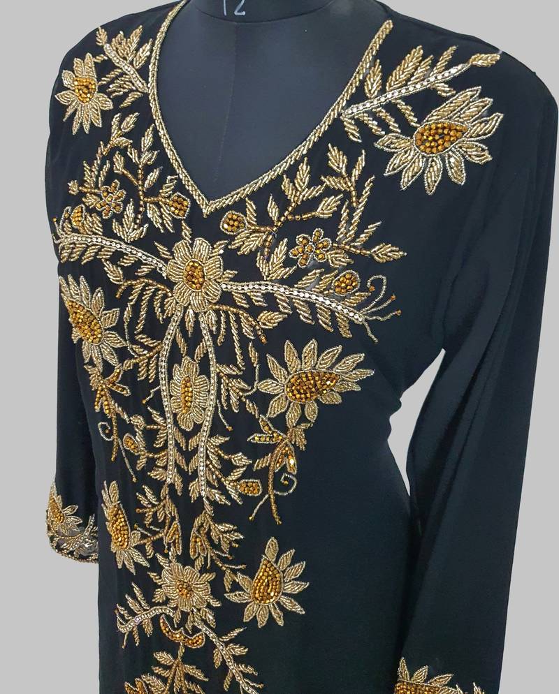 Elegant black georgette kaftan gown with golden zari work With hijab.