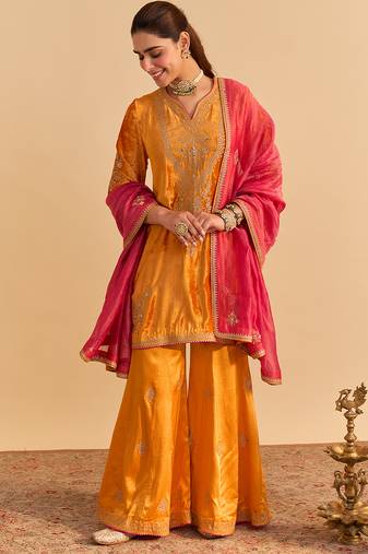 Orange embroidered velvet sharara set with dupatta