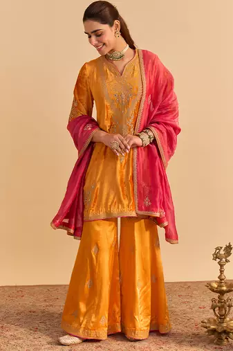 Orange embroidered velvet sharara set with dupatta