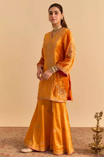 Orange embroidered velvet sharara set with dupatta