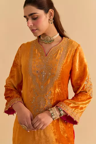 Orange embroidered velvet sharara set with dupatta