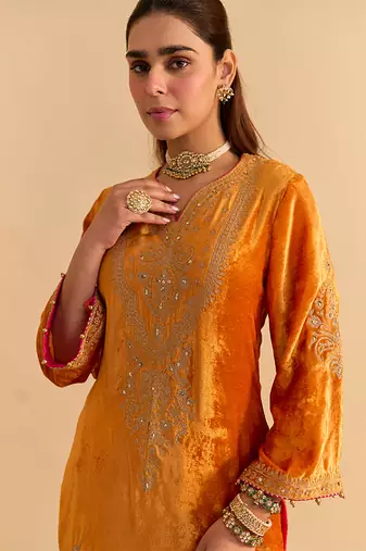 Orange embroidered velvet sharara set with dupatta
