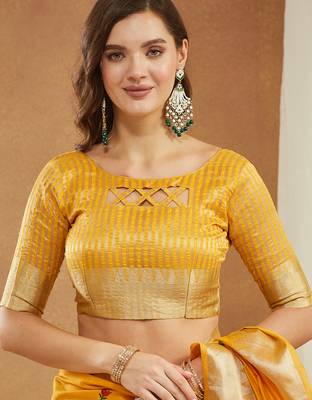 yellow assam cotton silk saree with embroidery and emple border  5
