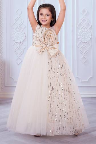 cream net gown with sequins and oversized bow