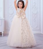 cream net gown with sequins and oversized bow
