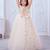 cream net gown with sequins and oversized bow